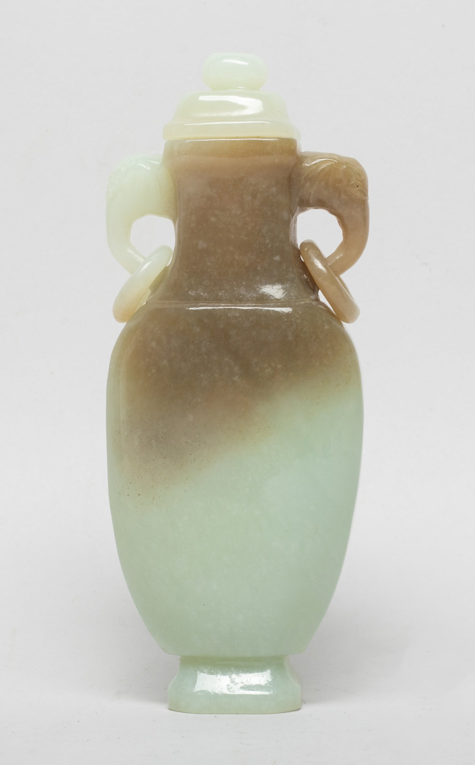 Chinese Russet Jade Cabinet Vase: Chinese russet jade covered cabinet vase with two elephant head loop handles. Approx. 5*1.9*1.2 inch.