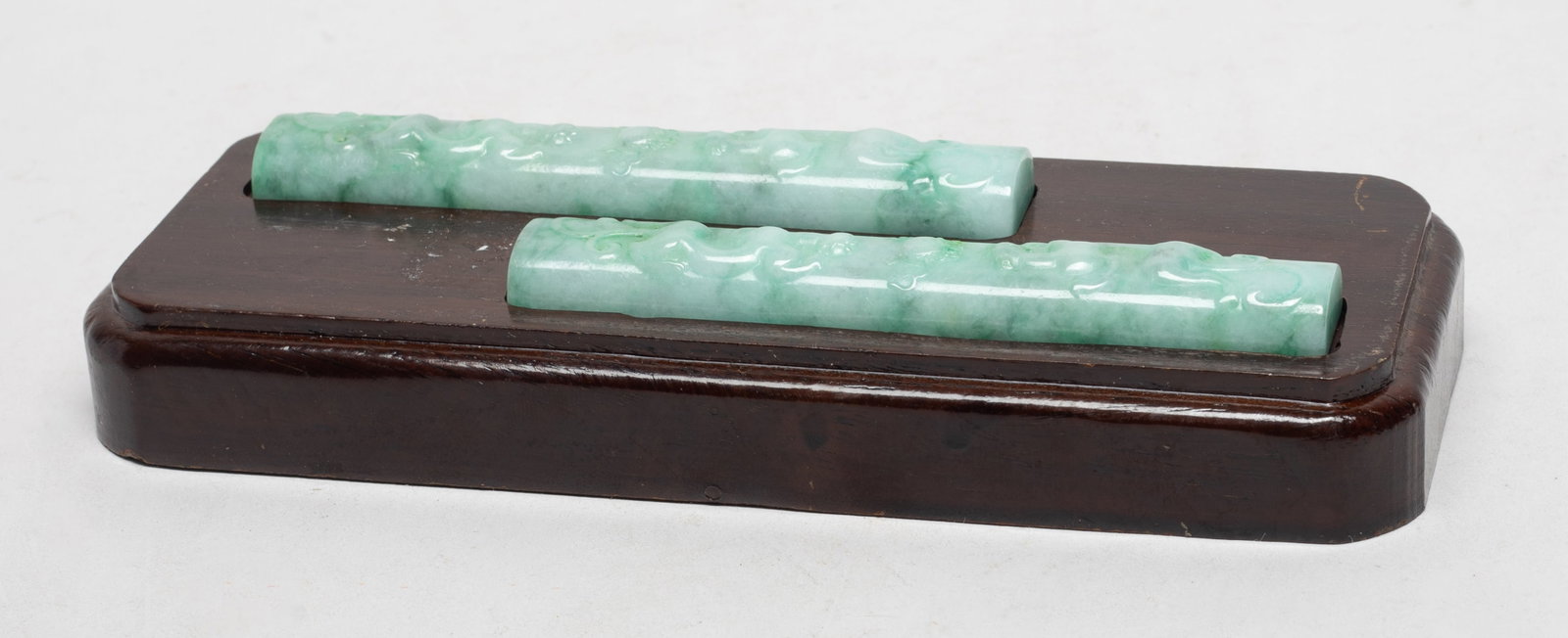 Chinese Jade Jadeite Paper Weight w/ Base: A pair of Chinese jade jadeite paper weights carved sinuous dragons, with wood base. Approx. 4.43*0.74*0.43 inch (each).