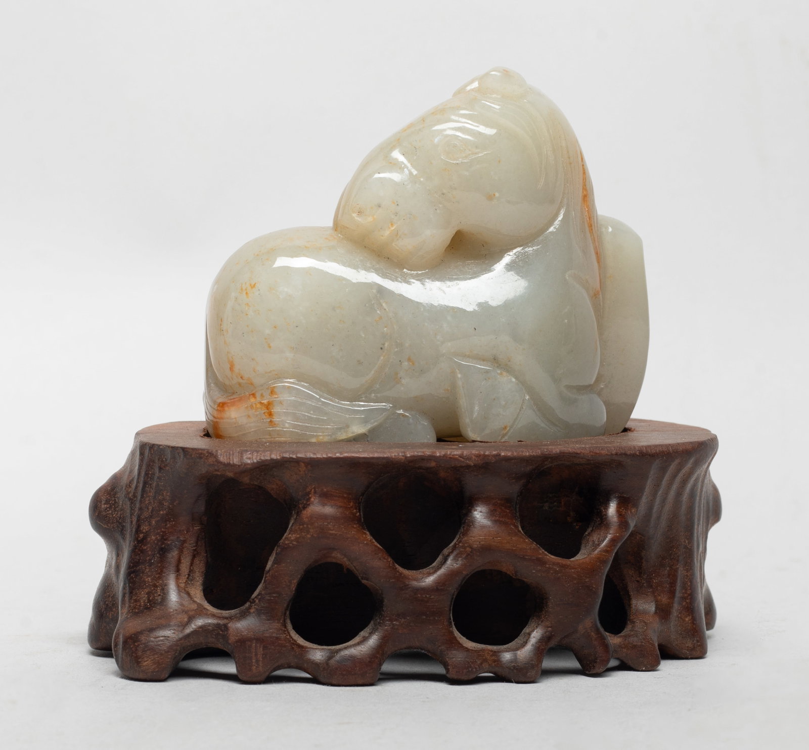 Estate Chinese Russet Jade Horse on Stand: Chinese russet jade carved recumbent horse sculpture, affixed to a wood stand. Approx. 4.2*3.7*2.7 inch (w/ stand).