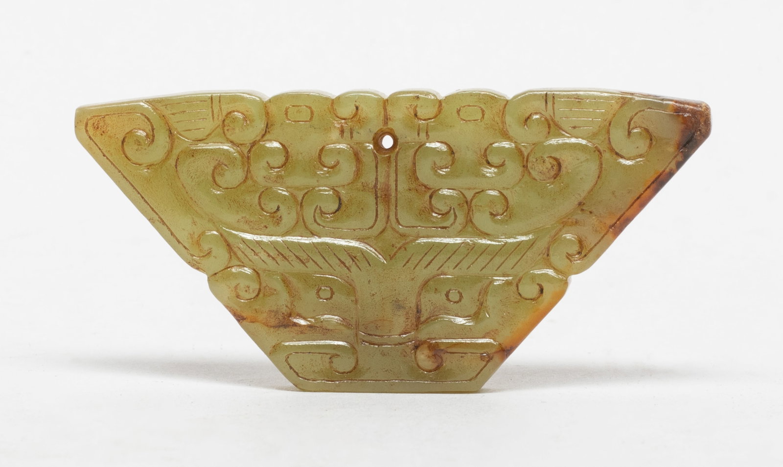 Vtg. Chinese Mask Form Jade Pendant: Special form Chinese jade pendant carved on either side with a mask below archaic beasts. Approx. 2.8*1.3 inch.
