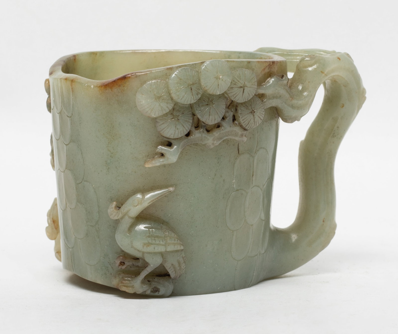 Rare Chinese Jade Carved Cup: Chinese russet jade cup, carved in relief with pine tree branches, cranes and lingzhi. Approx. 4*2.8*2.8 inch.