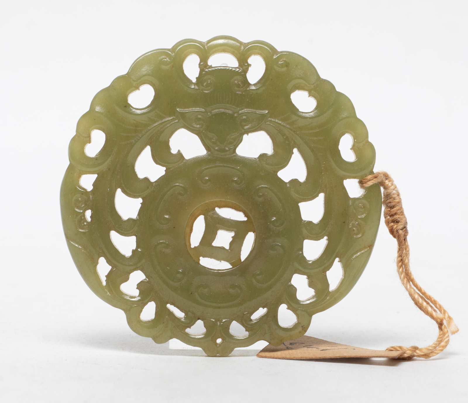 Chinese Yellow Jade Inside Moving Pendant: Chinese yellow jade inside moving pendant carved in openwork with bat encircling disc. Approx. 2.15 inch D.