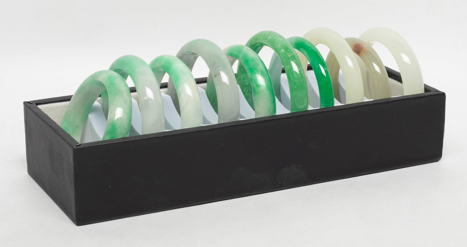 Set Chinese Export Bangles Collection: Set of 10 Chinese colored bangles, with case. Approx. 3.15 inch outer diameter, 2.35 inch inner diameter (largest).