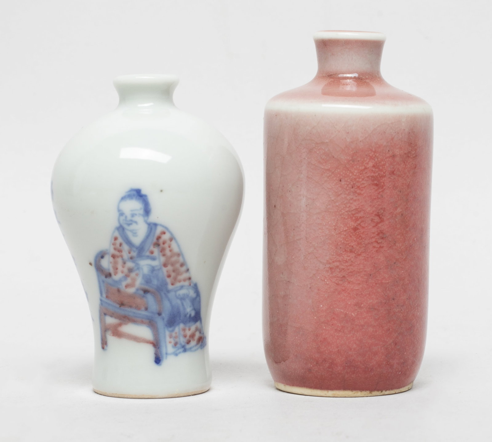 Estate Two Chinese Porcelain Snuff Bottles: One porcelain snuff bottle red glazed, the other decorated figure and inscription. Approx. 3.25*1.5 inch (larger).