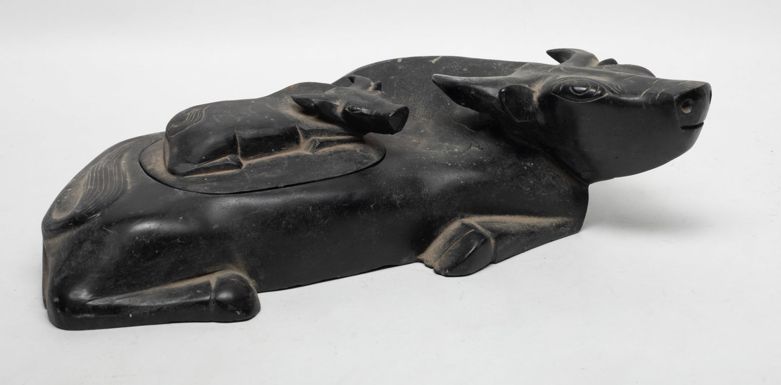 Large Antique Chinese Heavy Ink Stone: Large heavy Chinese ink stone of recumbent buffalo form, the cover carved a smaller similar buffalo. Approx. 12.7*3.5*7.3 inch.