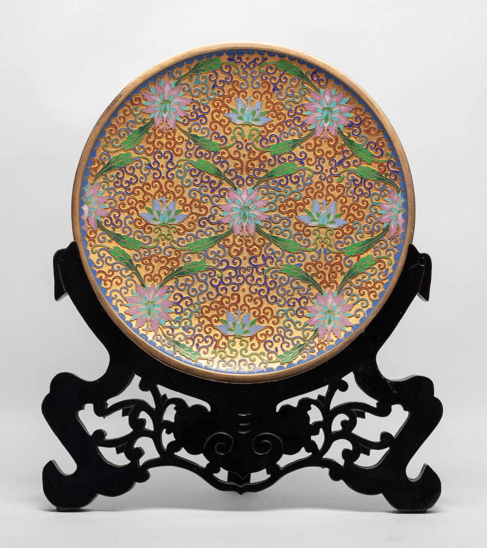 1970-80s Large Chinese Cloisonne Charger: Vintage large Chinese cloisonne charger, enameled lotus scrolls on golden-colored ground, with stand. Approx. 12 inch D (w/o stand).