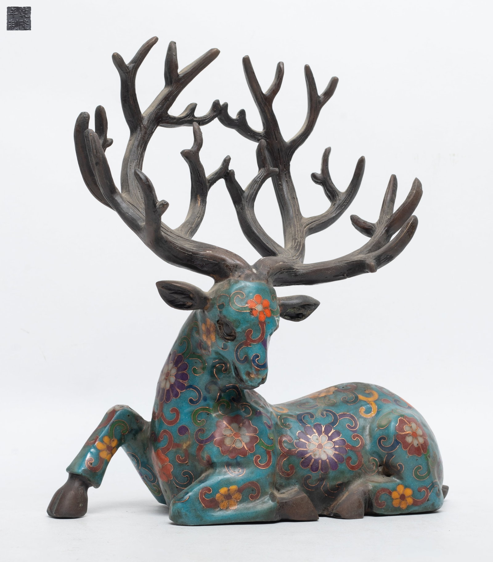 Estate Chinese Cloisonne Table Sculpture: Chinese cloisonne table sculpture of recumbent elk form, the body enameled flower scrolls on turquoise body. Approx. 9*8.4*3.5 inch.
