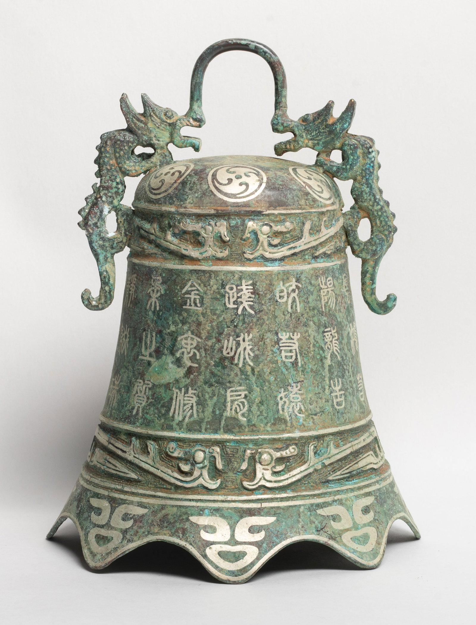 Estate Chinese Bronze Sculpture of Bell: Chinese bronze bell sculpture with dragon handle, decorated with ancient characters and archaic motif. Approx. 9.4*7 inch.