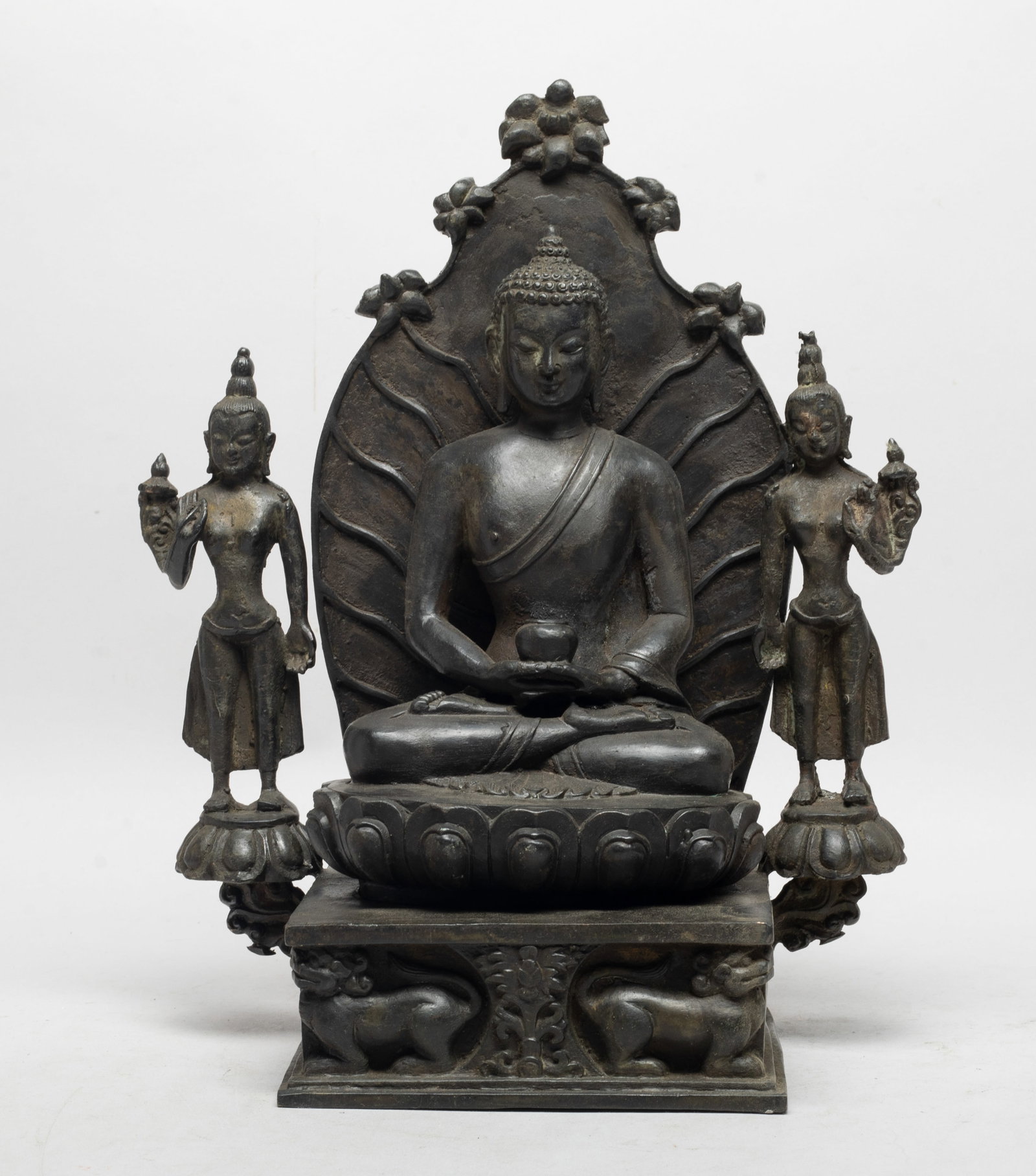 Estate Chinese Bronze Buddha: Chinese bronze cast seated Buddha, with stand cast with two standing Buddha. Approx. 12*9.7*5.2 inch.