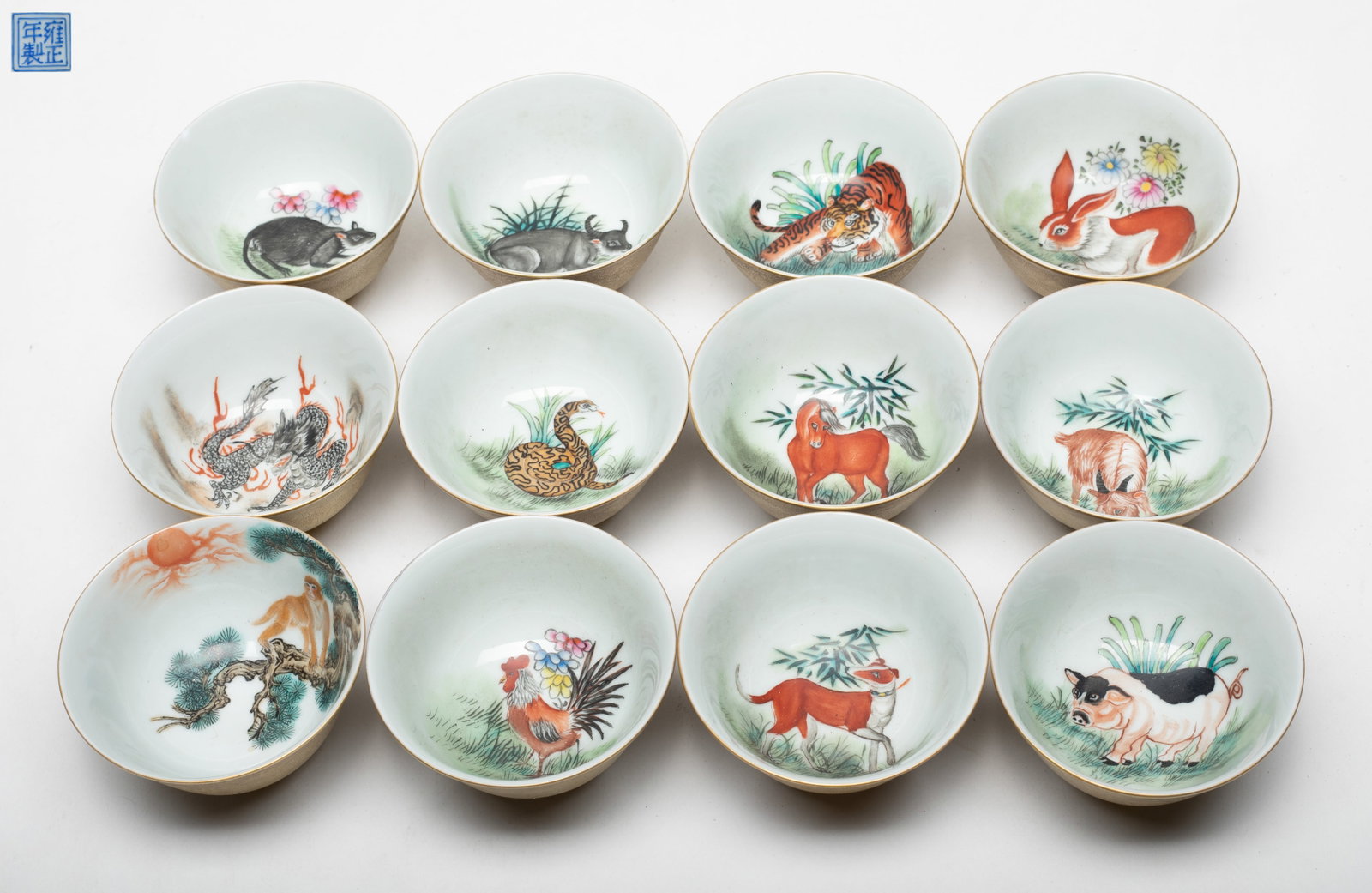 Large Set Chinese Export Porcelain Cups: Set of 12 Chinese porcelain cups, each interior painted with a Chinese twelve zodiac animal and bottom with a seal mark. Approx. 3.4*1.8 inch (each cup).
