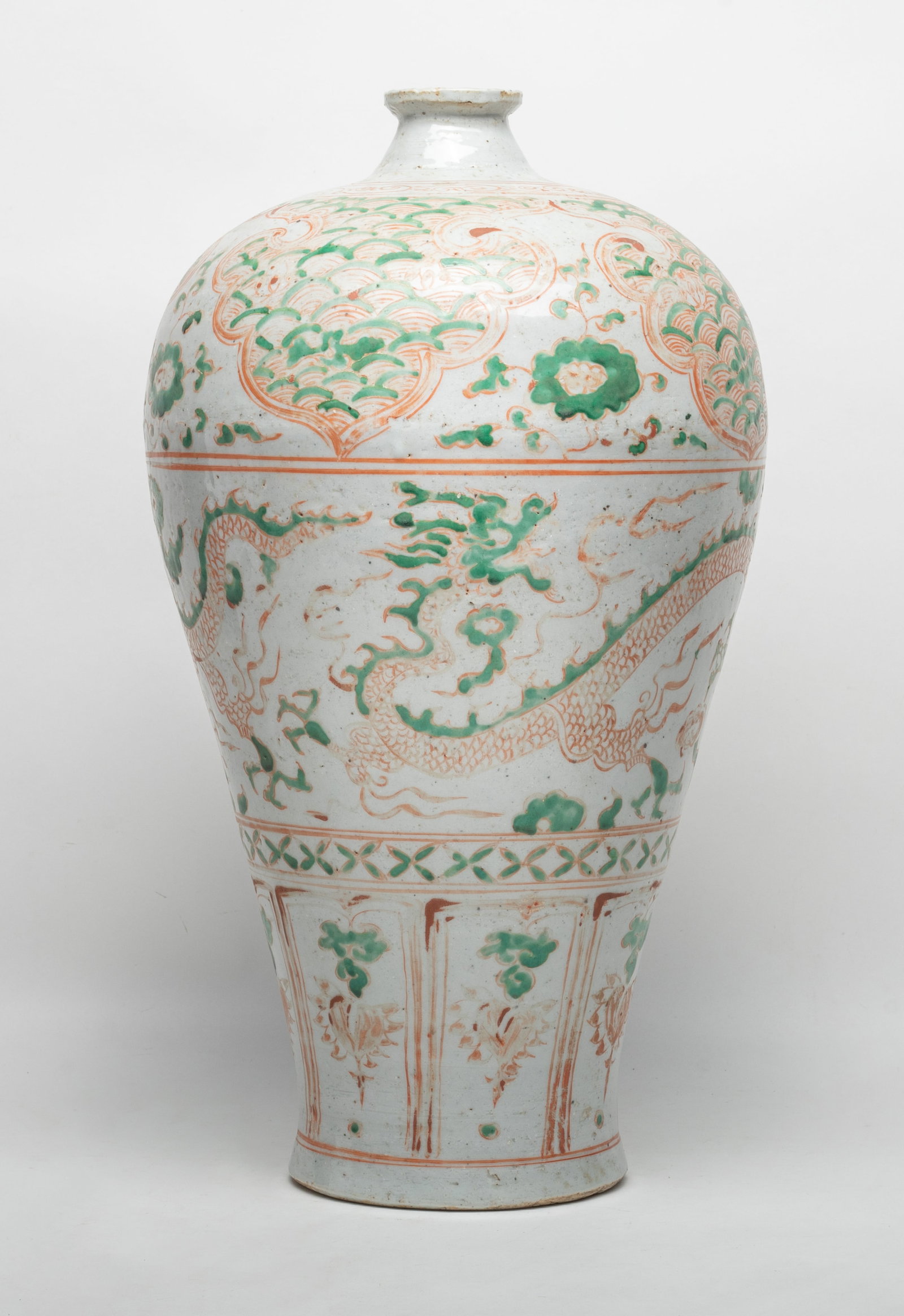 Tall Chinese Red & Green Porcelain Vase: Tall Chinese porcelain vase painted with dragons between bands of ruyi heads and lappets in green and red colors. Approx. 17.5*9.5 inch.