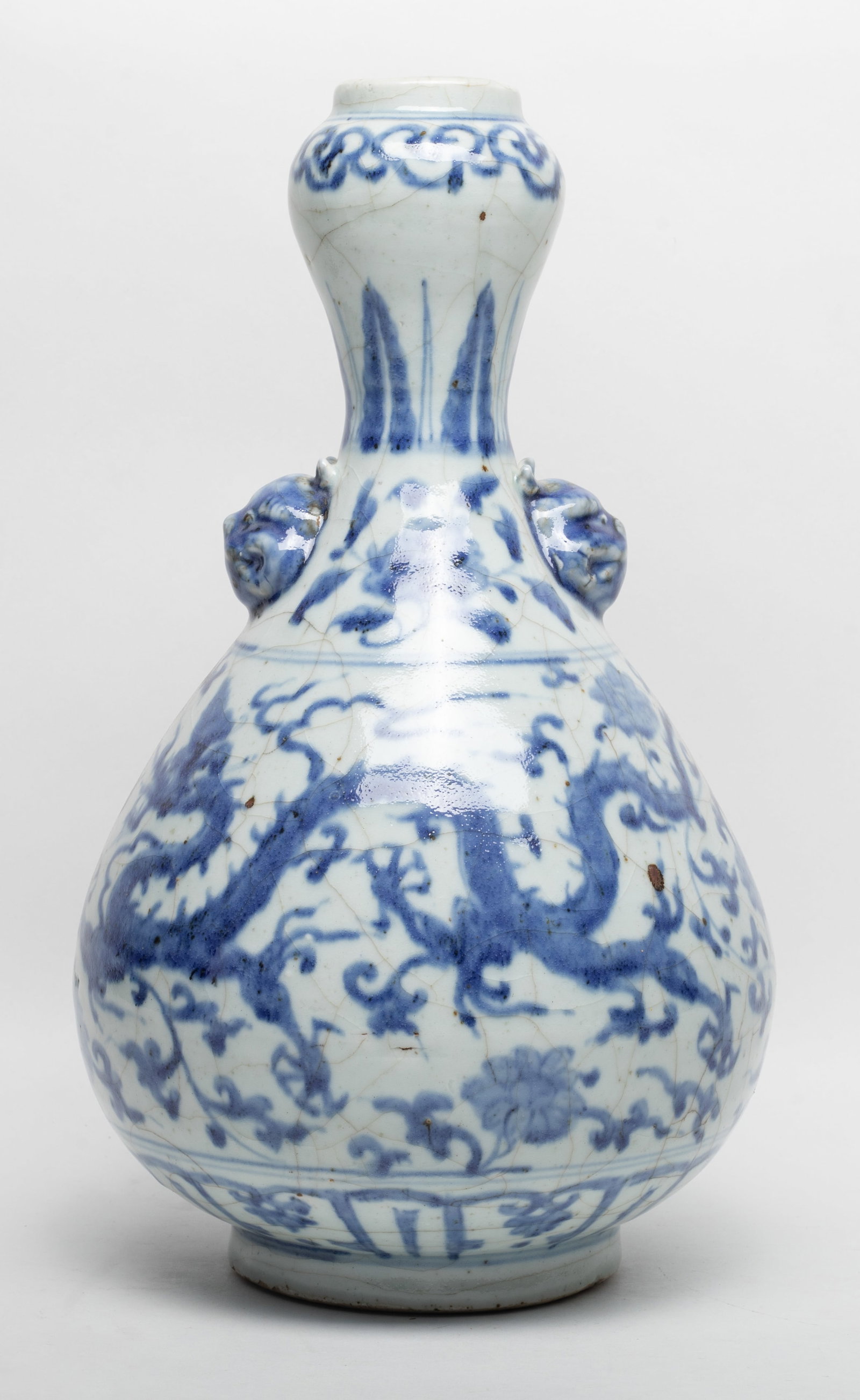 Chinese Shipwreck Type Porcelain Vase: Chinese blue and white crackled porcelain vase, decorated with dragons and lotus sprays. Approx. 13*7.6 inch.