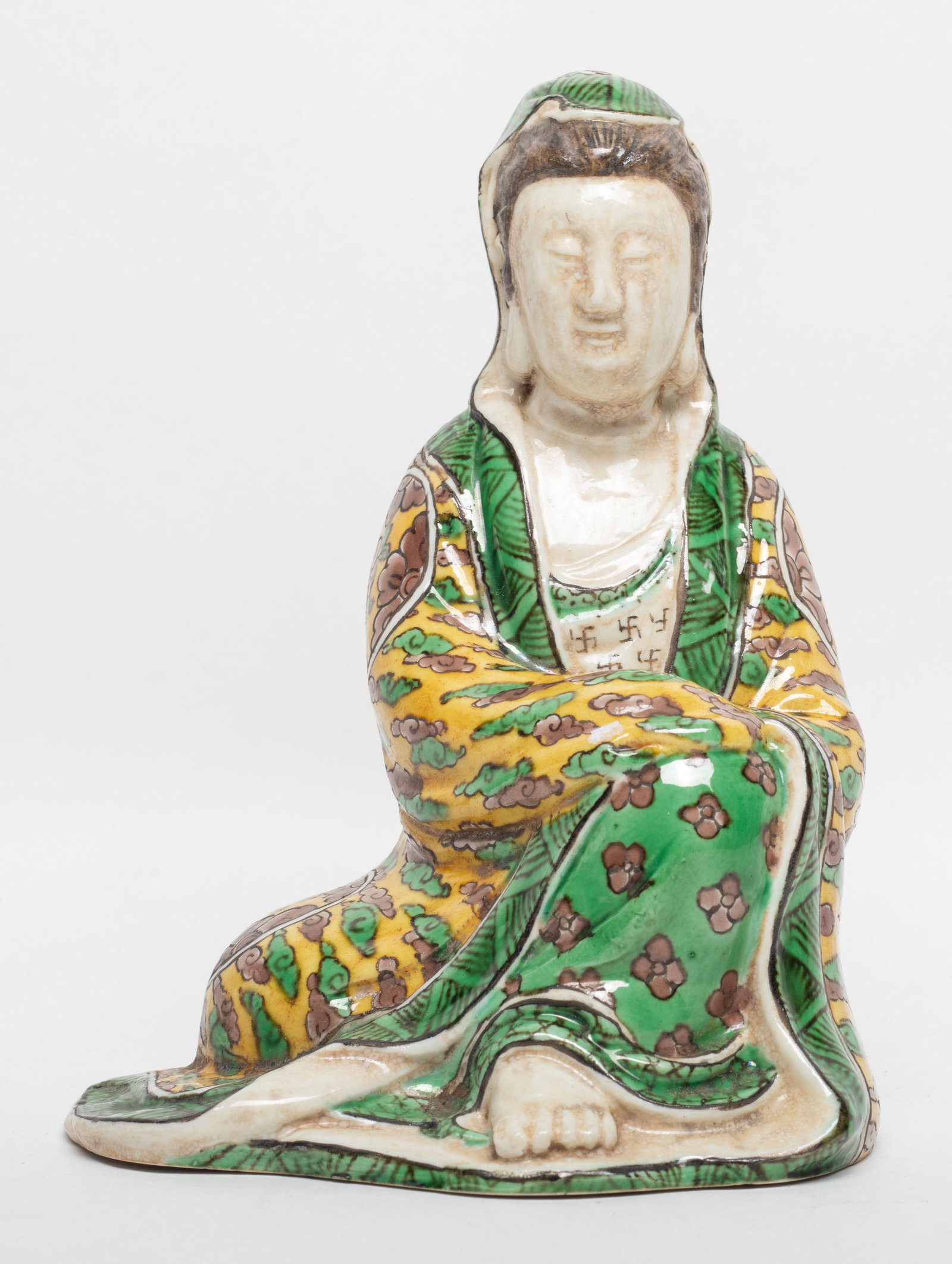 Chinese Sanchai Glazed Porcelain Kuanyin Sculpture: Chinese Sanchai glazed porcelain sculpture of seated Kuanyin, six-character mark to the bottom. Approx. 6.6*5*4.2 inch.