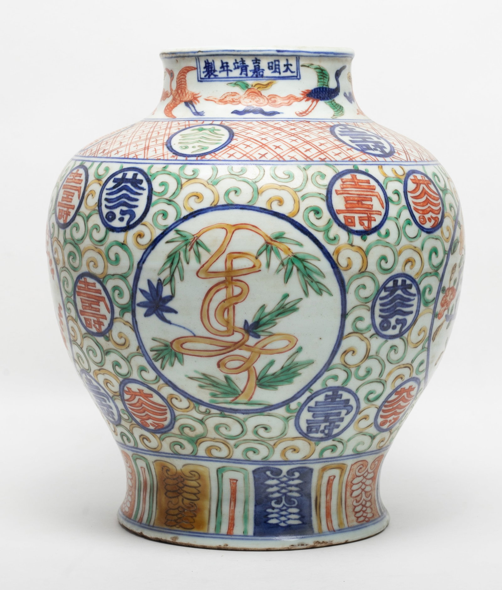 Large Chinese Export Porcelain Jar: Large heavy Chinese porcelain jar decorated stylized characters, marked six characters on the rim. Approx. 11*9.5 inch.