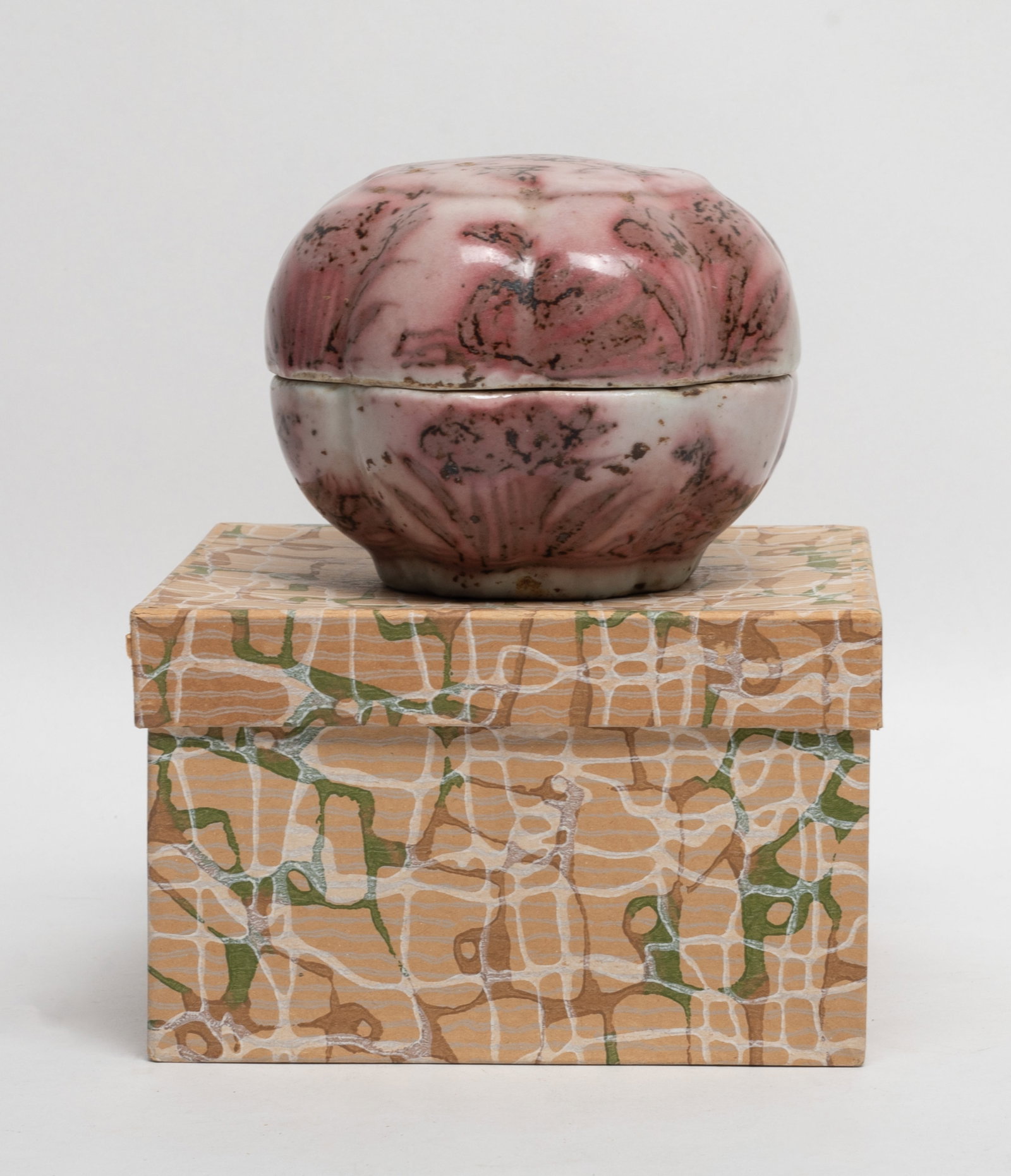 Chinese Copper Red Glazed Porcelain Box: Floral form Chinese porcelain box, painted lotus and mandarin ducks in copper red, with box. Approx. 3.2*4.2 inch.