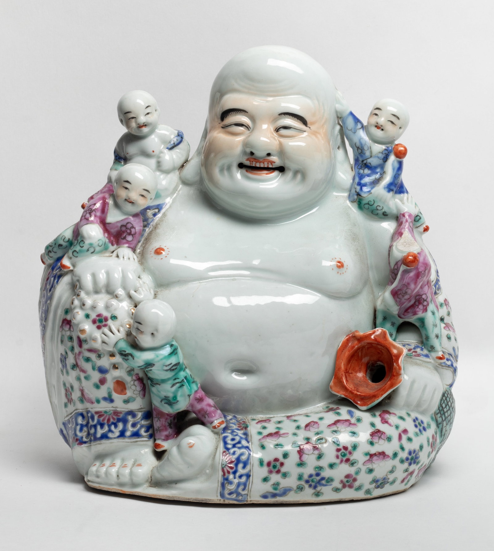 Large Chinese Famille Rose Porcelain Buddha: Large Chinese famille rose porcelain sculpture in form of seated Buddha and five boys. Approx. 10.3*10*6.5 inch.