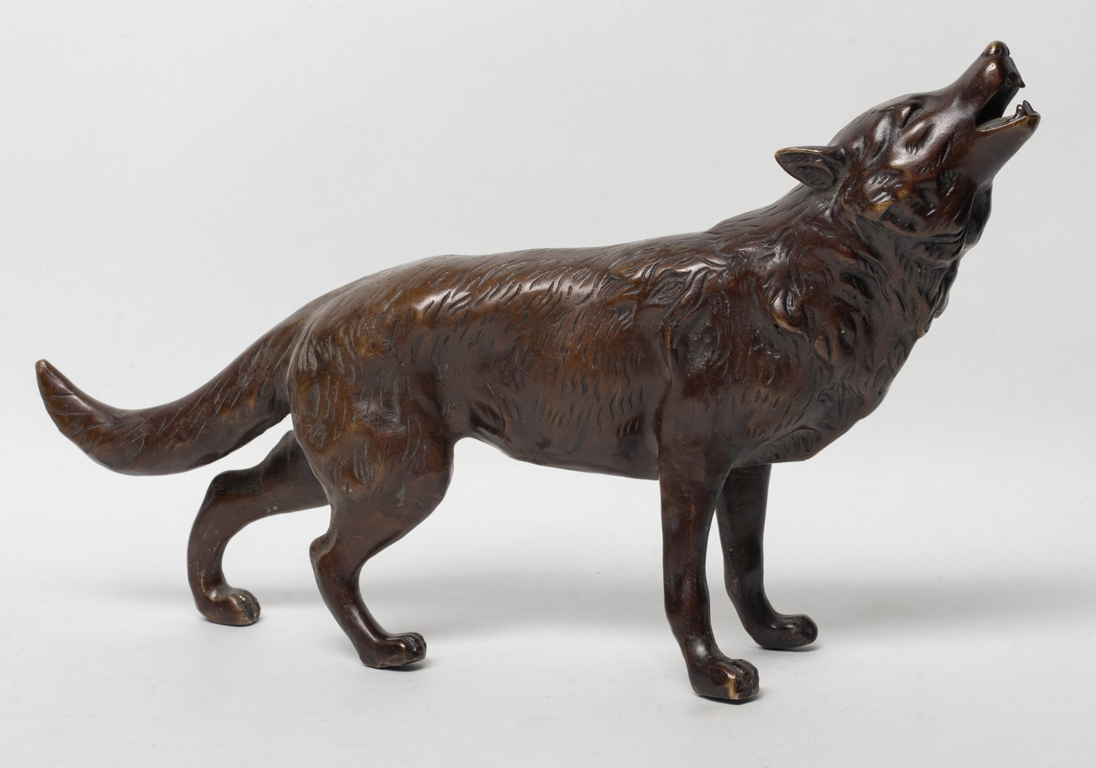 Vintage Mid-century Bronze Sculpture: Vintage bronze wolf/dog table sculpture. Approx. 12.7*7.2*2.7 inch.