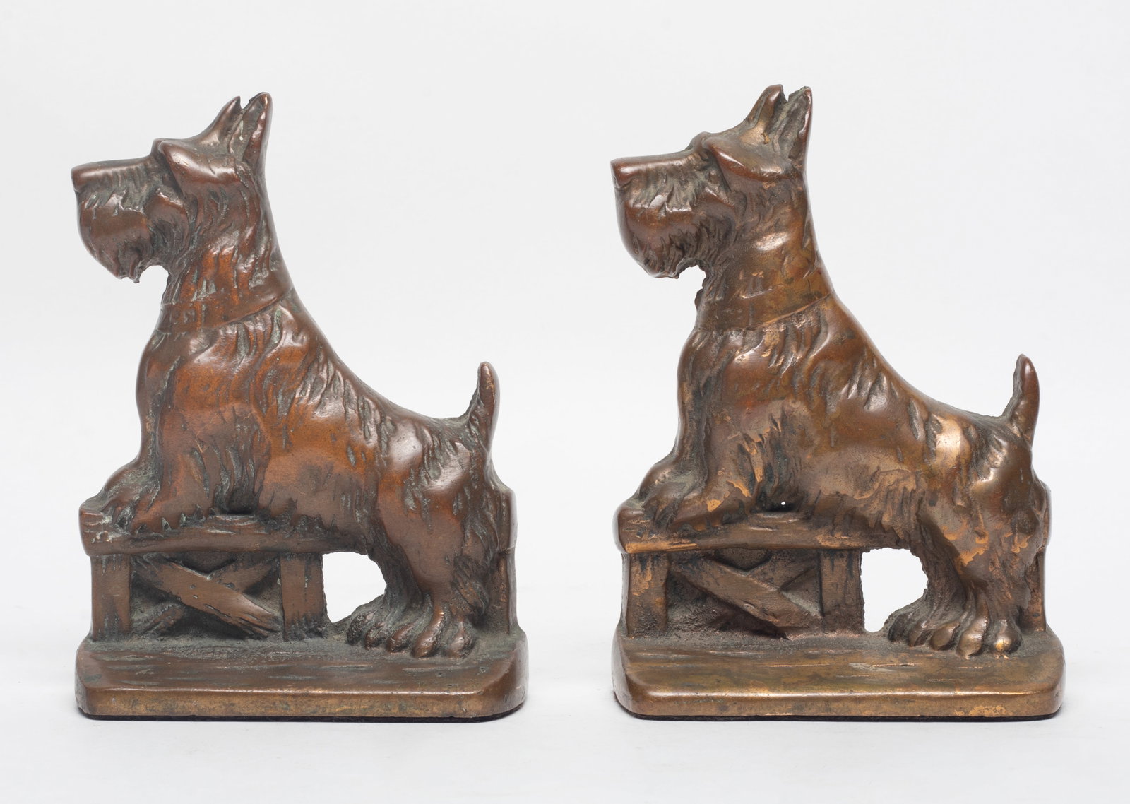 Bronze Dog Schnauzer: Early 1900s Bookends: Pair of early 1900s schnauzer dog bookends. Approx. 6*4.5*1.6 inch (each).