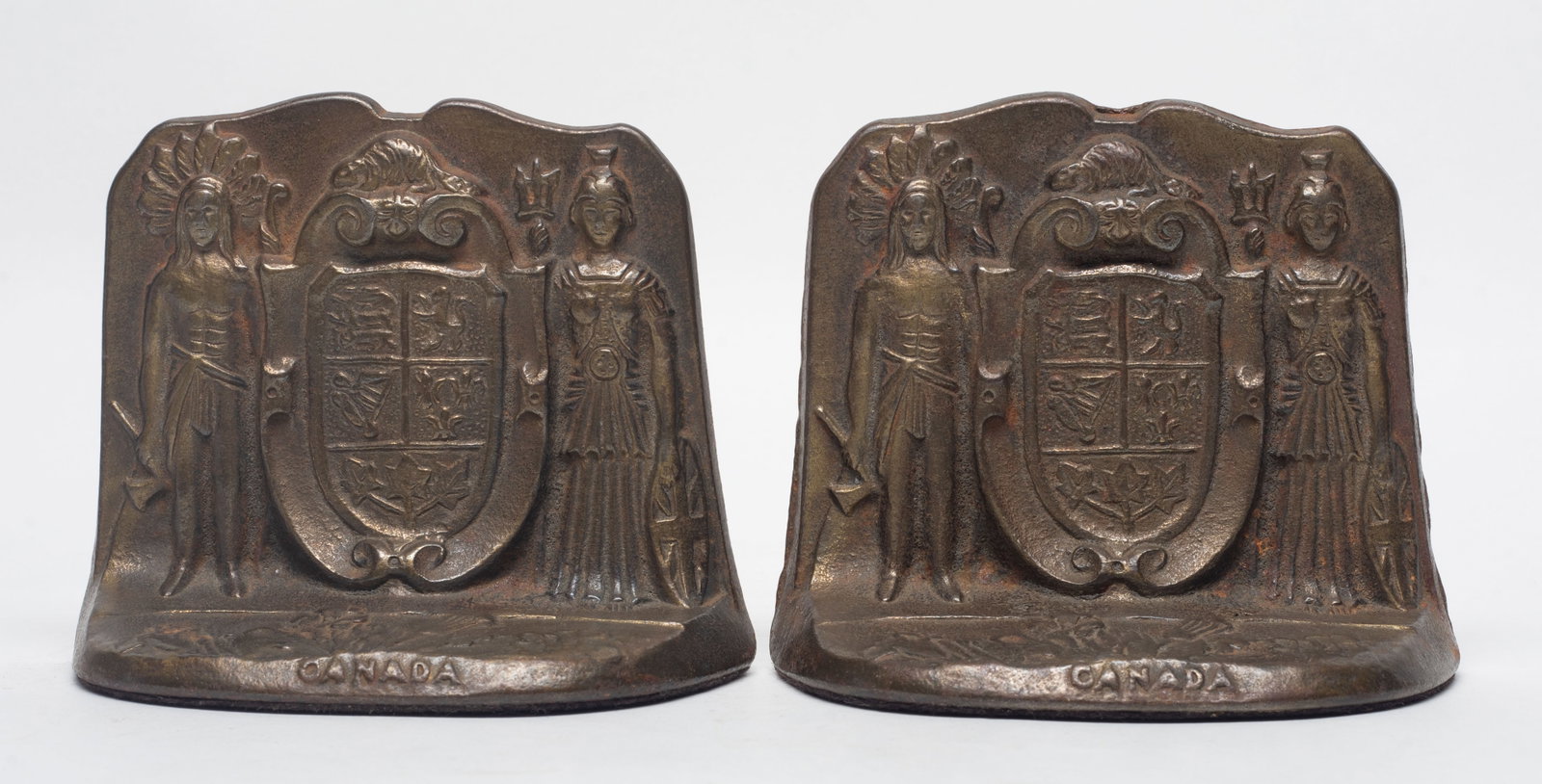 Early 20th Antique Cast Iron Bookends: Pair of early 20th century cast iron bookends, marked CANADA. 5.2*4.2*2.3 inch (each).