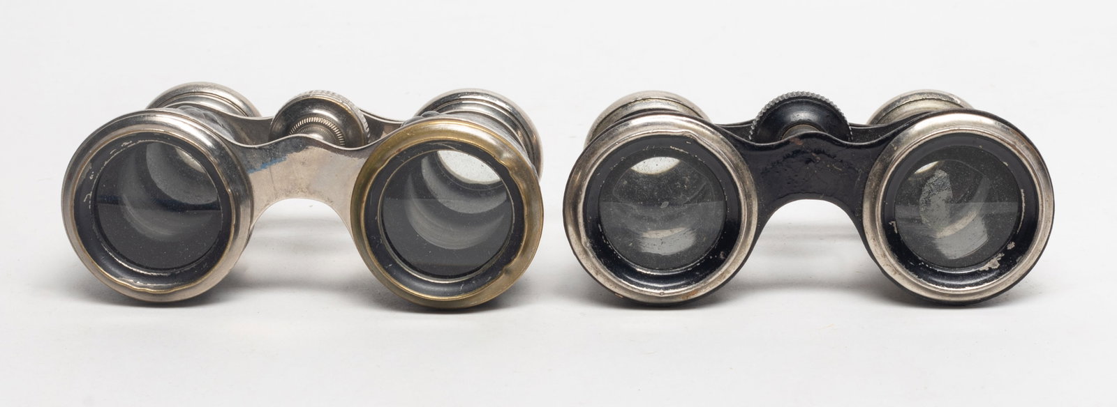 Two Antique Opera Glasses: Two vintage opera glasses. Approx. 4.1*2.7*1.65 inch (larger).