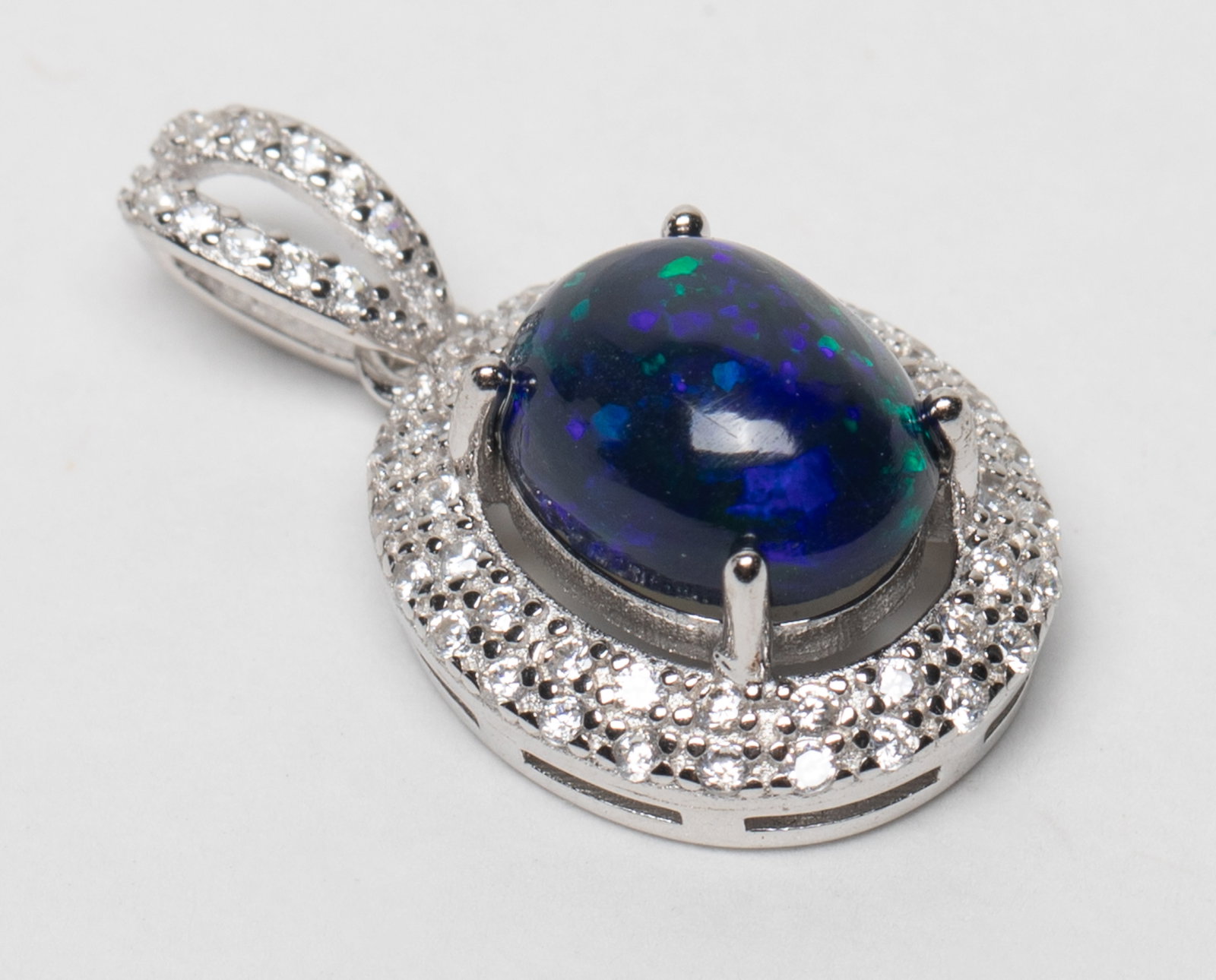 Vintage Fine Fire Opal Pendant: Vintage pendant marked S925, inlaid fire opal stone. Approx. 1.5 gram, 0.63*0.47 inch.