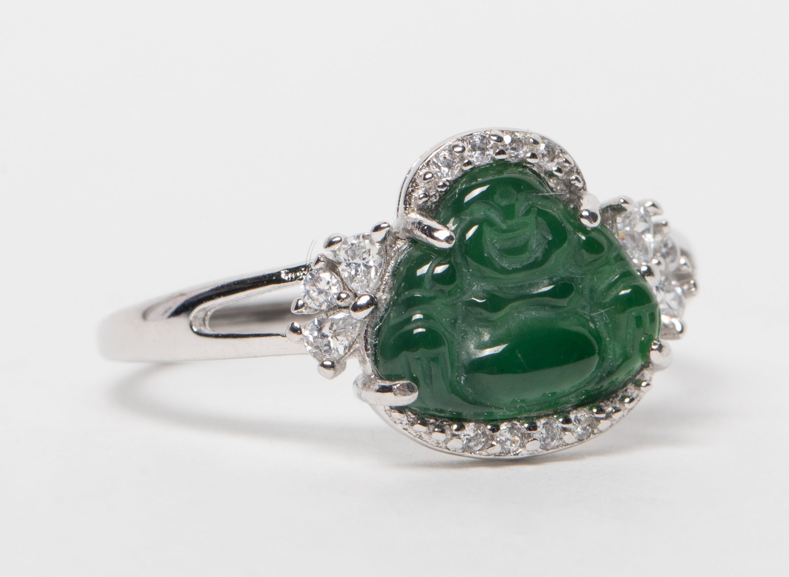 Vtg. Chinese Jade Carved Ring: Adjustable ring, inlaid with green jade carved Buddha. Approx. 1.54 gram. US size: 7.