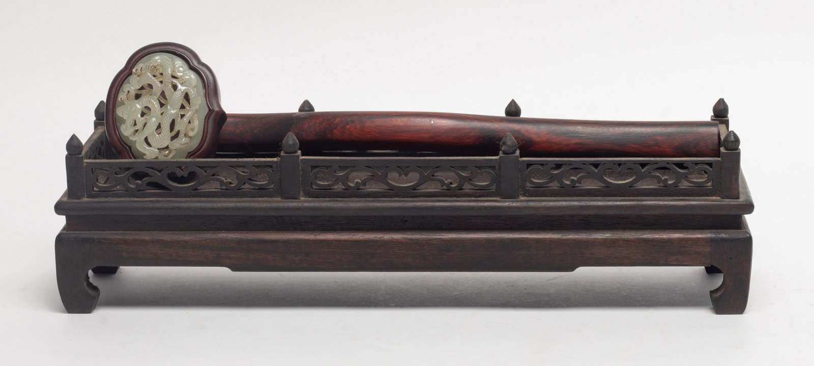 Chinese Wood Inlaid Jade Sculpture of Ruyi: Chinese wood ruyi, inlaid jade at head carved dragon and lingzhi in openwork, with wood stand. Approx. 10.7*2.6*2.3 inch (ruyi size).