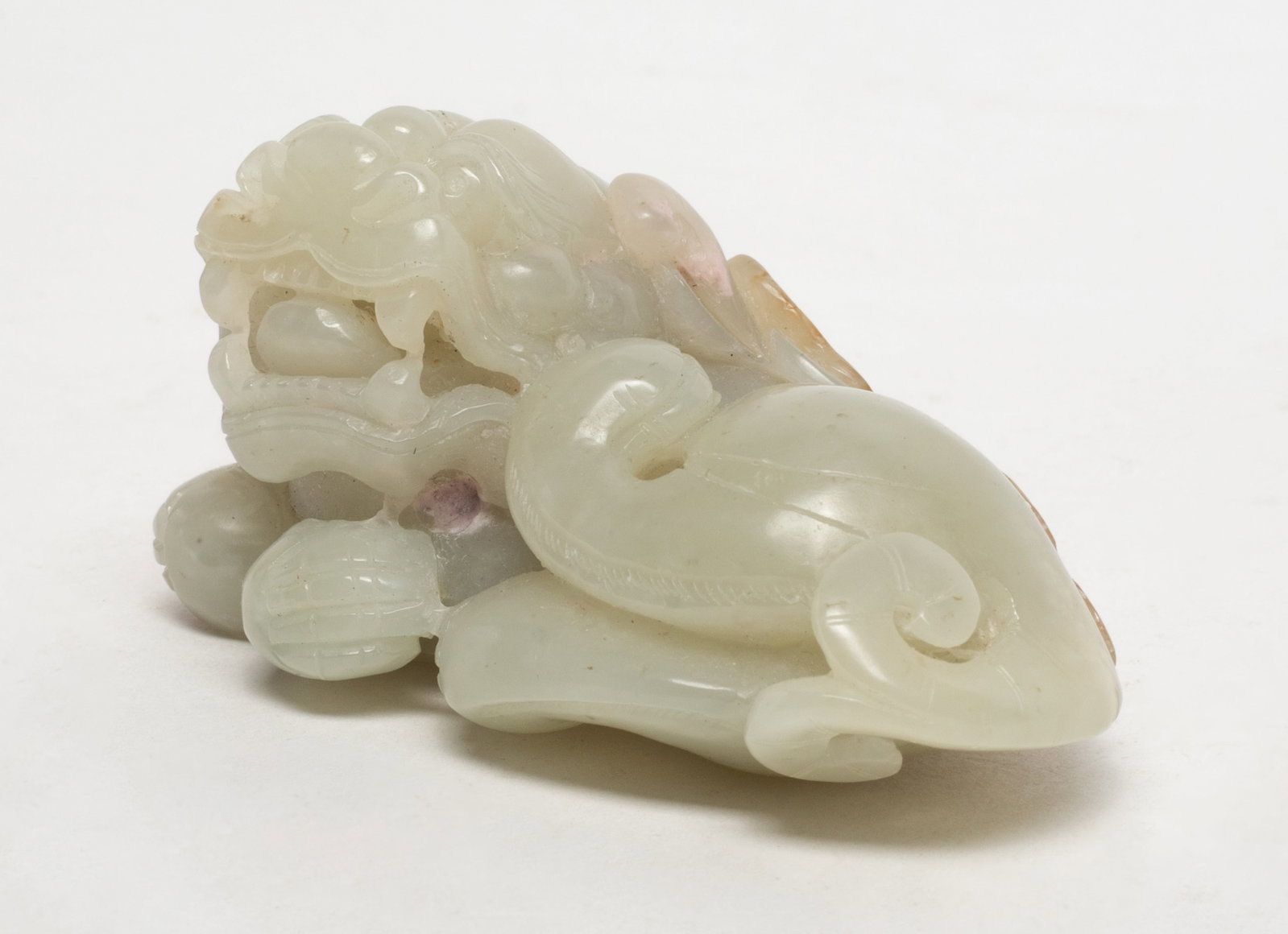 Rare Chinese Russet White Jade Beast: Chinese white and russet jade sculpture carved as recumbent beast with lingzhi and coin. Approx. 2.9*1.7*1.5 inch.