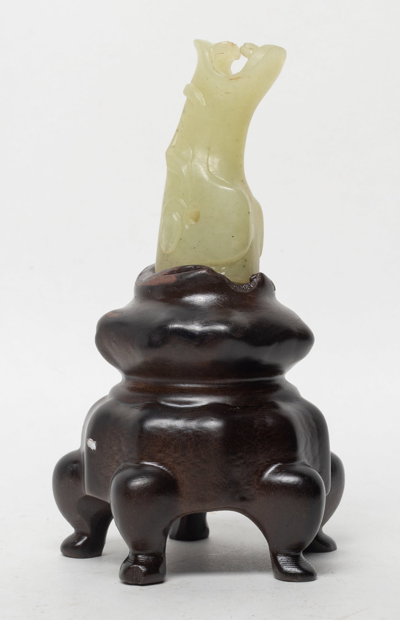 Unusual Chinese Jade Carved Horse Head Sculpture: Chinese jade carved stylized horse head sculpture, with stand. Approx. 2.45*1.07*0.93 inch (w/o stand). The Estate of the K. T. Lam. HK. 1998.