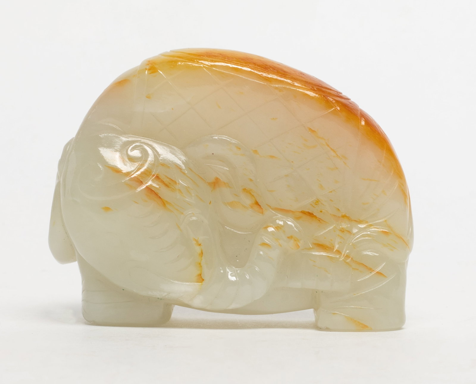 Chinese Russet White Jade Sculpture: Chinese white and russet jade sculpture carved of elephant form. Approx. 2.7*2.05*1 inch.