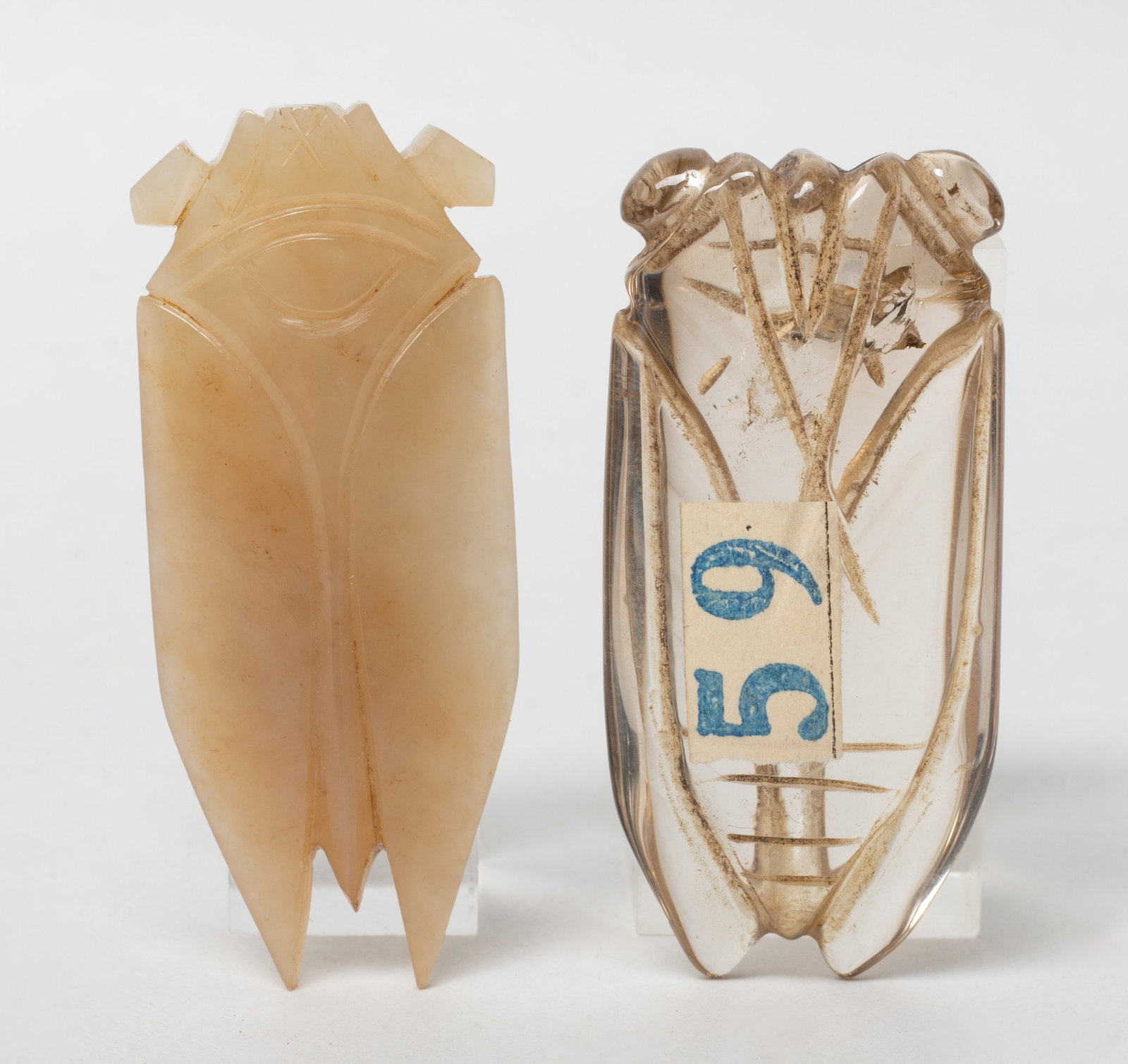 Chinese Jade, Rock Crystal Cicada Pendants: Chinese russet jade and rock crystal carved cicada form pendants Approx. 2.44*1 inch (larger).