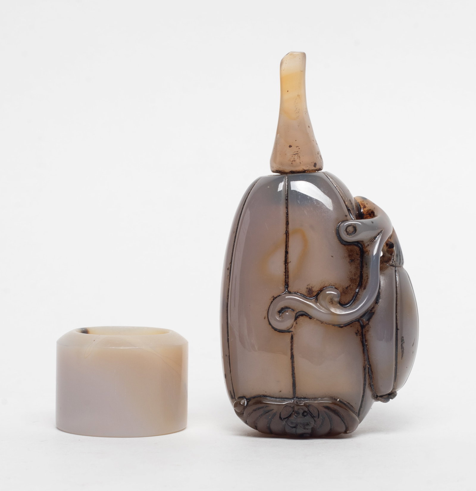 Chinese Cameo Agate Snuff Bottle, Thumb Ring: Chinese cameo agate thumb ring and gourd form snuff bottle detailed with bat and smaller gourd. Approx. 3.7*1.94*1.4 inch (bottle size).