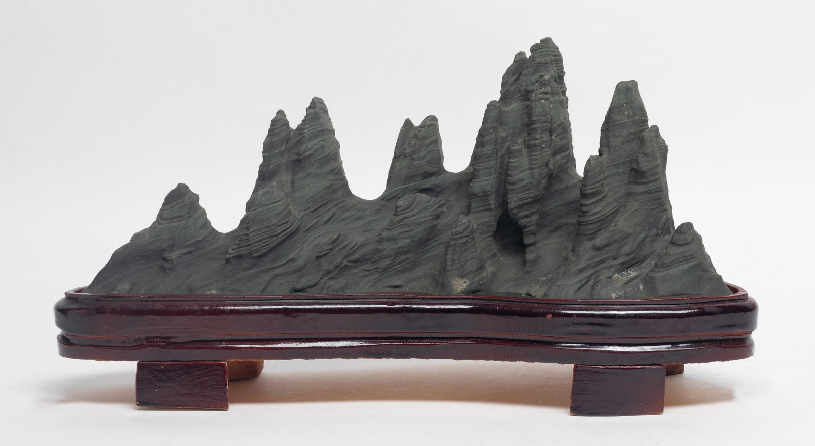 Estate Chinese Scholar Stone w/ Wood Base: Of horizontal orientation, the rock formation in the shape of a mountain range, with stand. Approx. 11*5.7*4.4 inch (w/ stand).