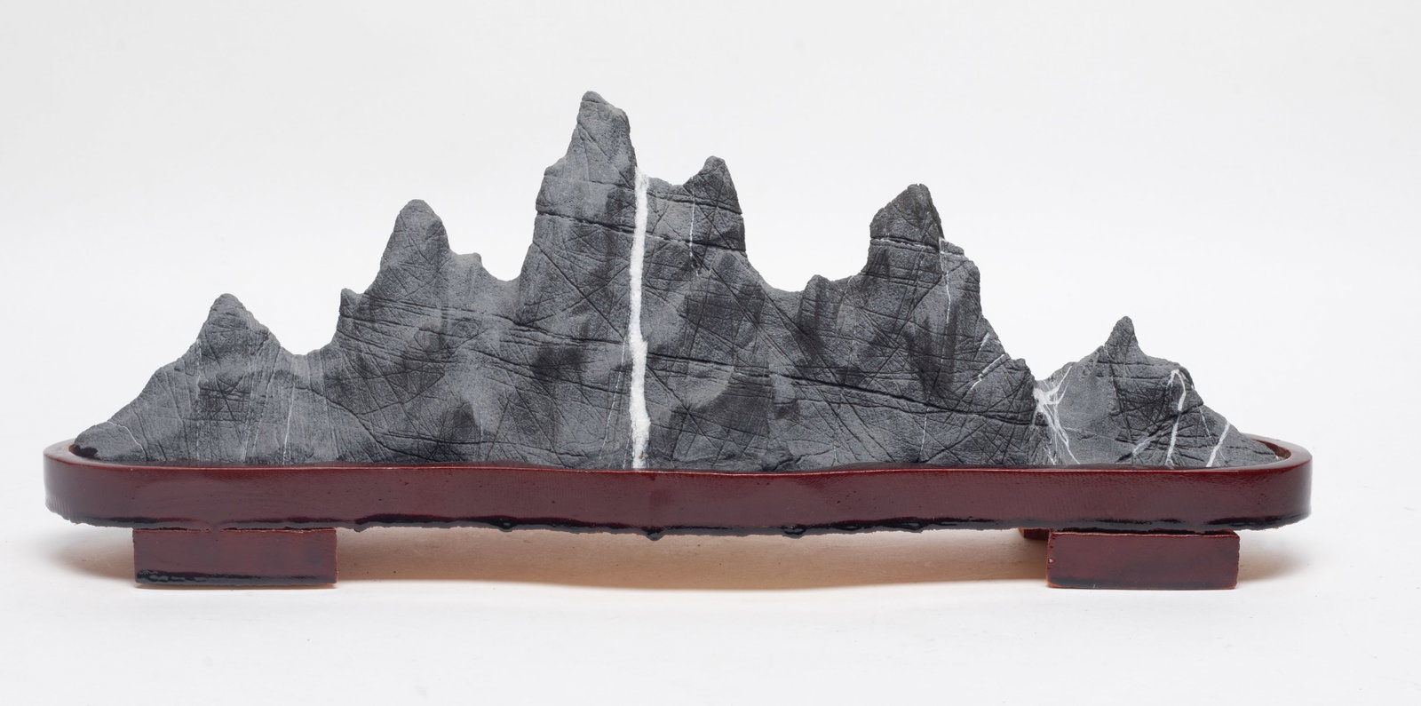 Vtg. Chinese Scholar Stone Sculpture: Of horizontal orientation, the rock formation in the shape of a mountain range, with stand. Approx. 15.2*5.5*4 inch (w/ stand).
