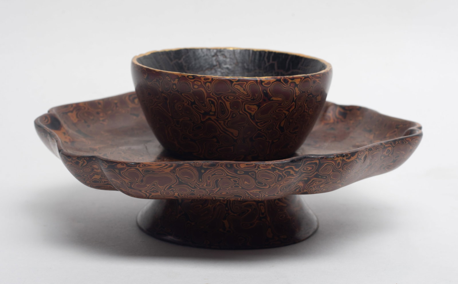 Estate Chinese Lacquer Made Tea Cup Base: Chinese floral form lacquer made tea cup base. Approx.6.5*2.8 inch.