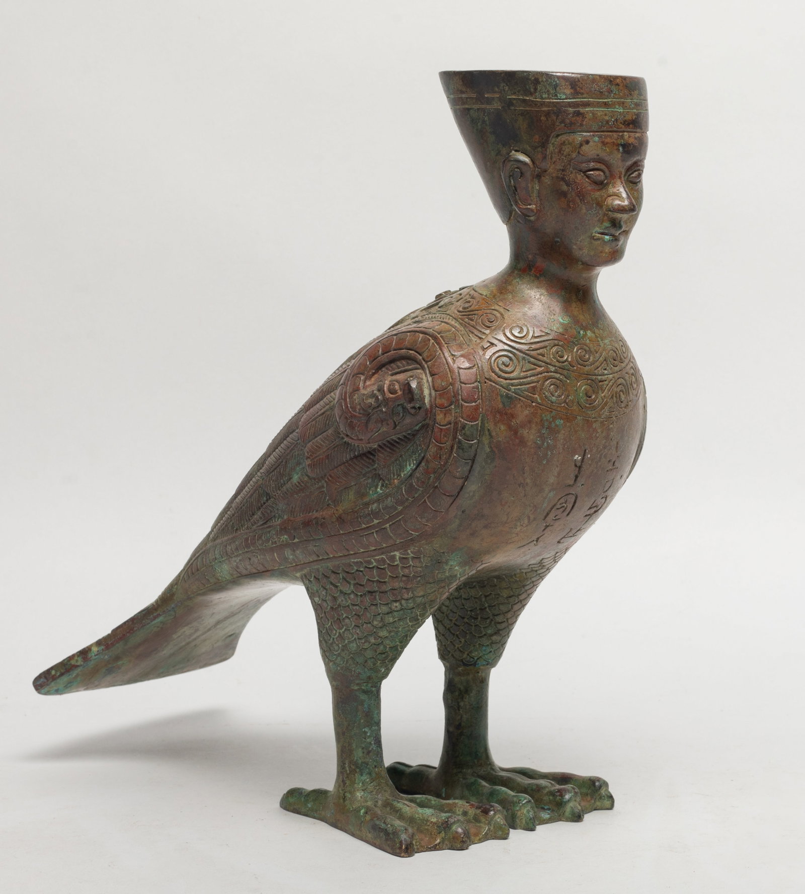 Unusual Chinese Bronze Sculpture: Special form Chinese bronze sculpture with human head and bird body. Approx. 9.5*9.3*4.2 inch.