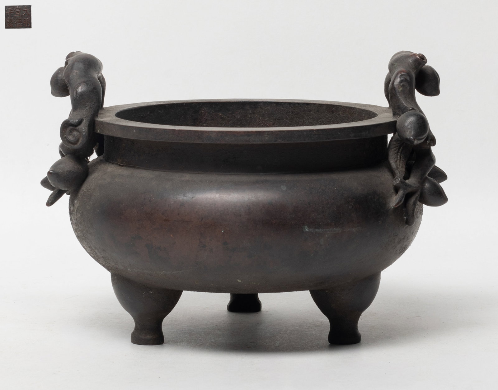 Estate Chinese Large Bronze Censer: Large heavy Chinese bronze censer with peach branch form handles, marked six characters to underside. Approx. 7.5*6.7*5.4 inch.