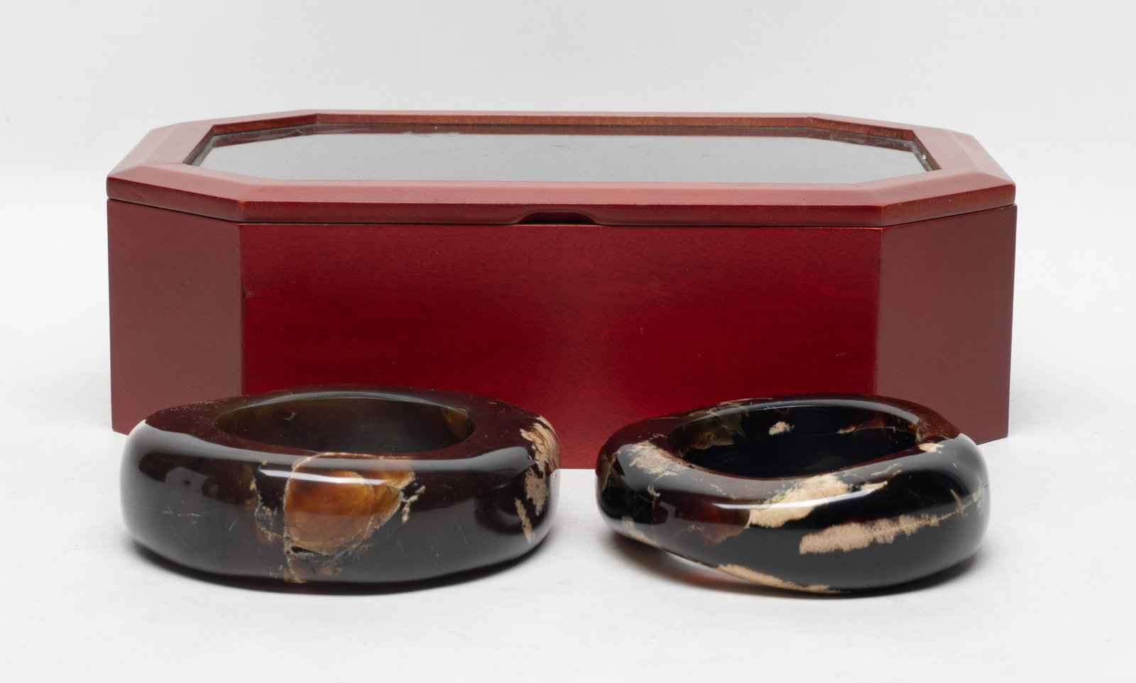Two Asian Chunk Root Amber Bangle: Two Asian root amber carved chunky bangles, with box. Approx. 290 gram (total weight), 4.4 inch outer diameter, 2.7 inch inner diameter (larger bangle).