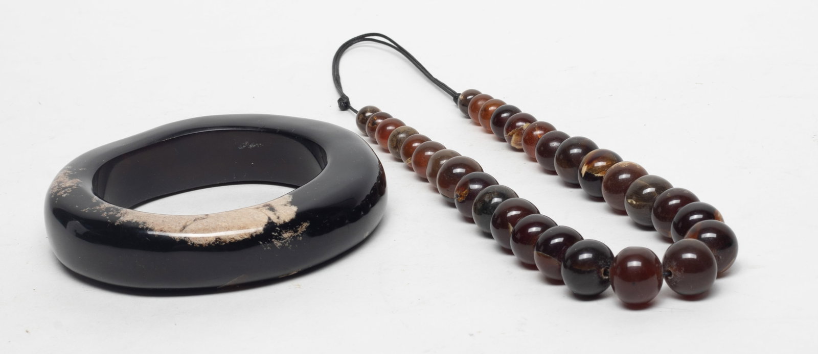 South Asian Root Amber Bangle, Necklace: south Asian root amber carved chunky bangle and bead necklace. Approx. 162 gram (total weight), 4.3 inch outer diameter, 2.9 inch inner diameter (bangle size).