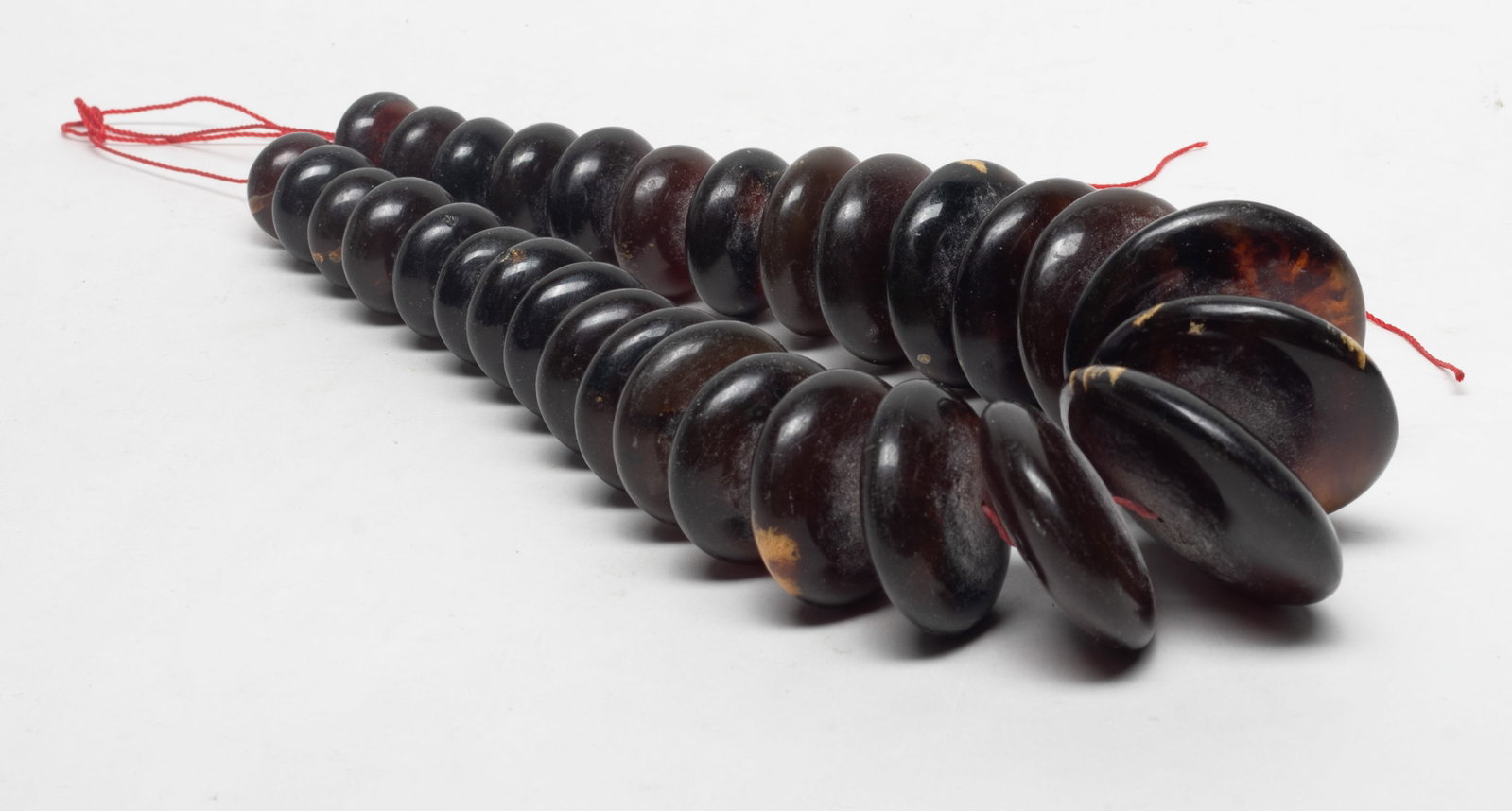 Chunk Dish Bead S Asian Root Amber: South Asian root amber carved chunky dish bead necklace. Approx. 264 gram (total weight), 2 inch D (largest bead).