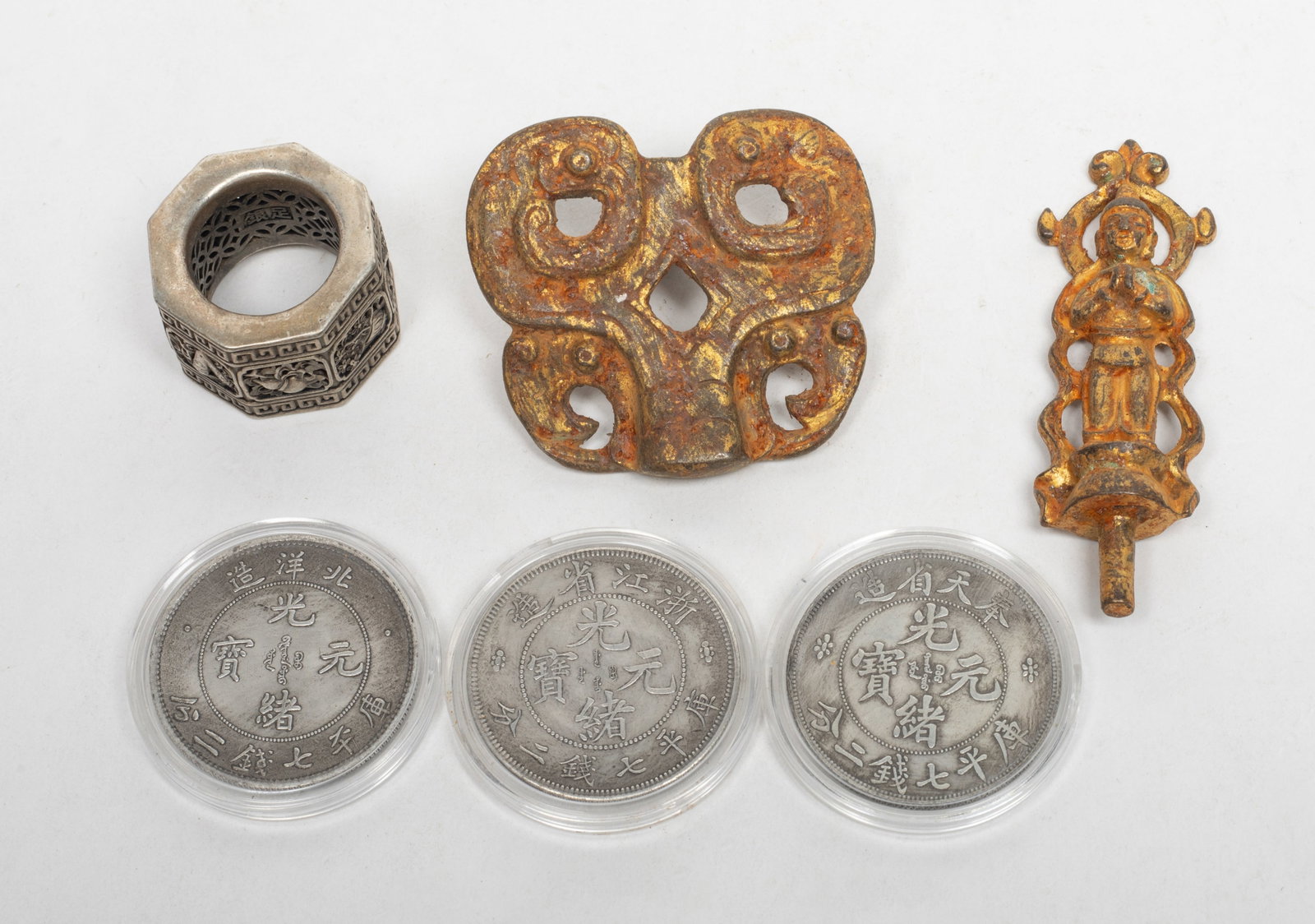 Set Chinese Bronze, Gilt Buddha, Fengshui Coins: Including three Fengshui coins, a thumb ring, a Buddha sculpture, and a hook. Approx. 2.3*2.1*0.9 inch (largest).