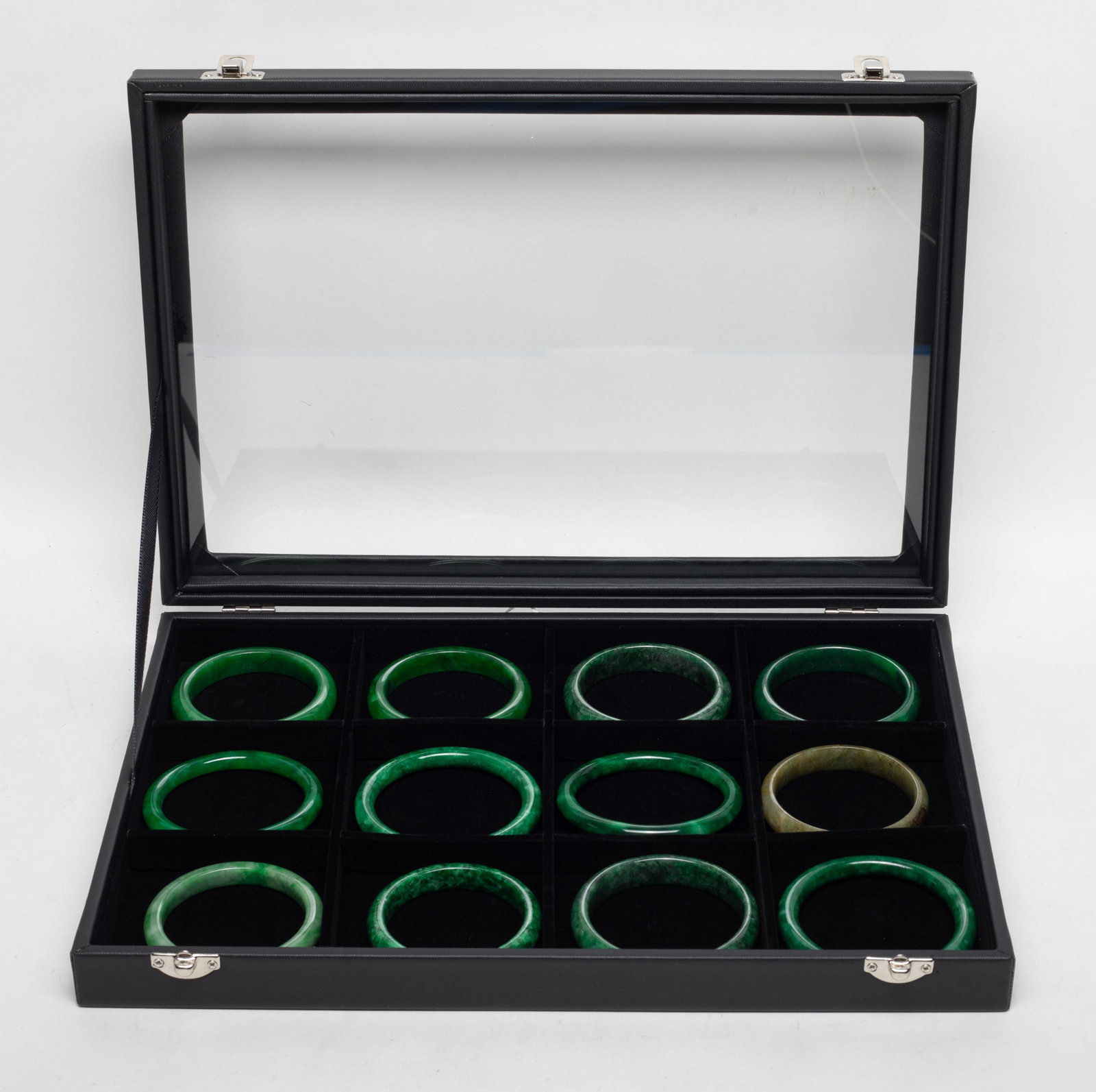 Box of Chinese Export Colored Stone Bangles: Set of 12 Chinese colored stone bangles, with case. Approx. 3.05 inch outer diameter, 2.4 inch inner diameter (largest).