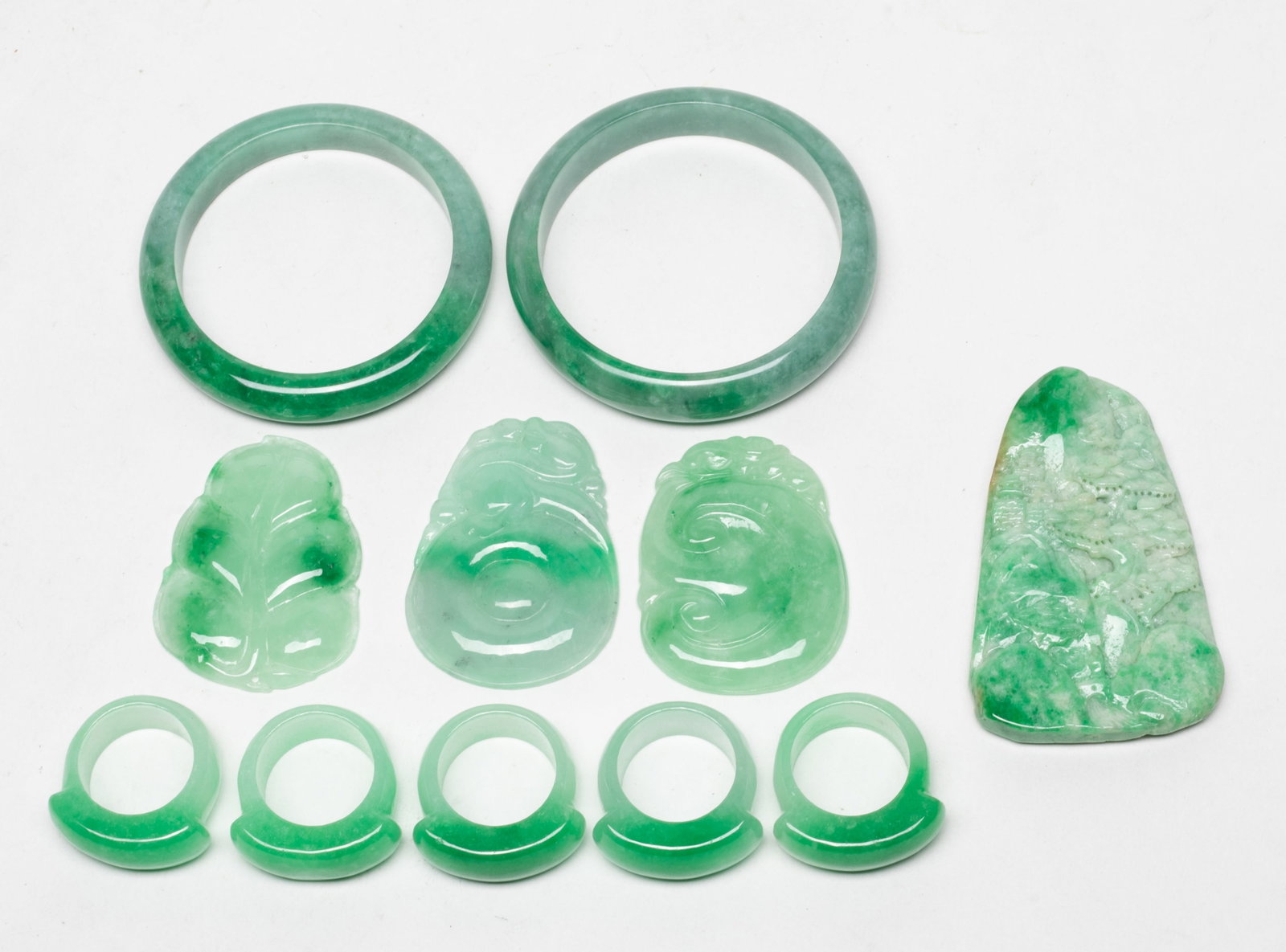 Set Chinese Export Bangles, Rings, Pendants: Including two colored bangles, five thumb rings, and four pendants. Approx. 2.84 inch outer diameter, 2.3 inch inner diameter (larger bangle).