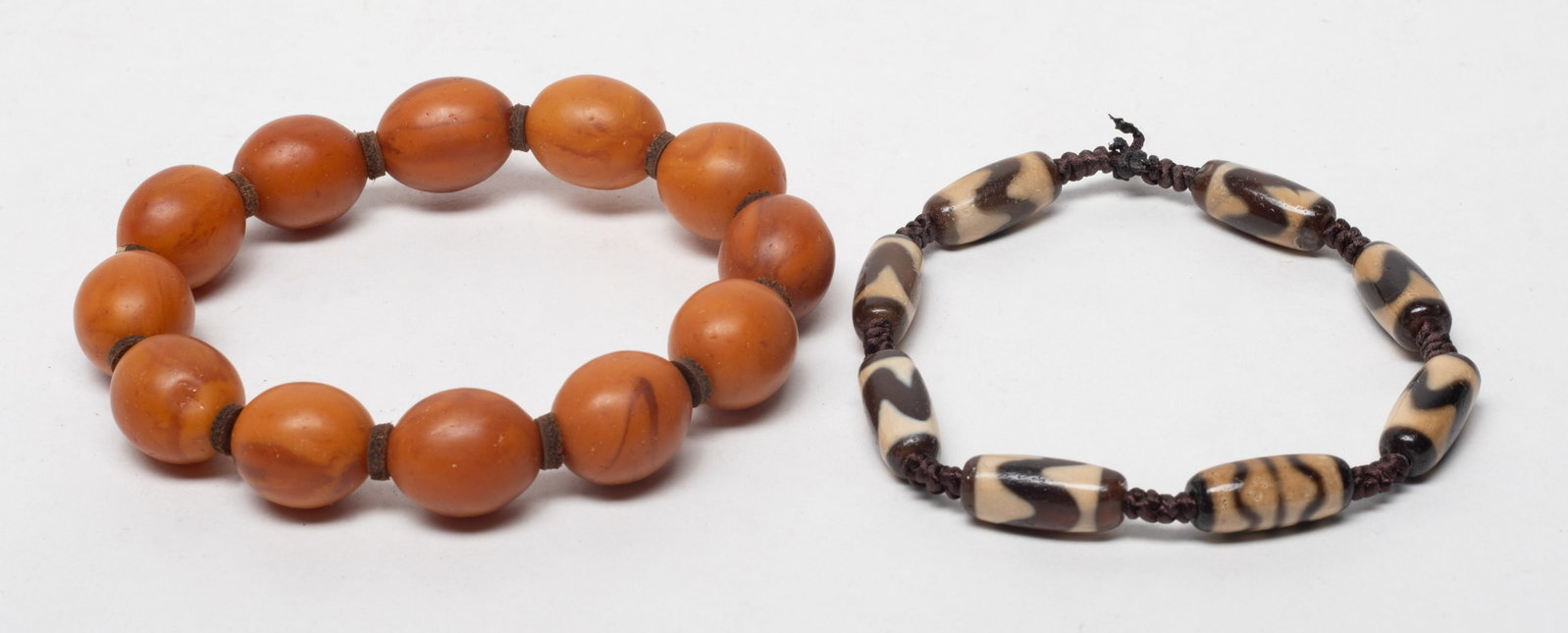 Chinese Amber & Dzi Bead Prayer Beads: Two strings of Chinese amber prayer beads and dzi beads. Size varies.