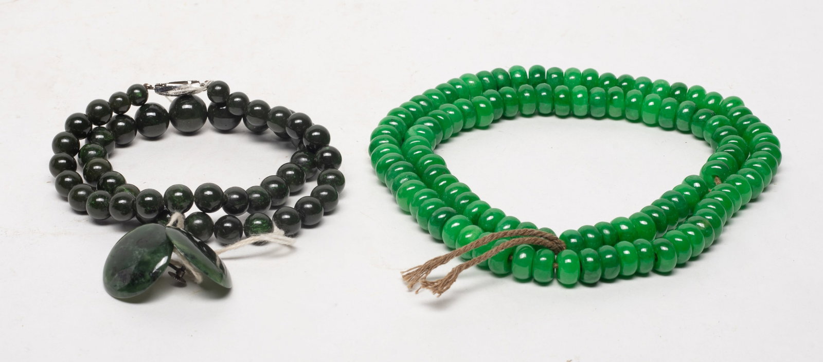 Two Chinese Colored Necklaces: Including two colored bead necklaces. Approx. 24 inch L (longer necklace).