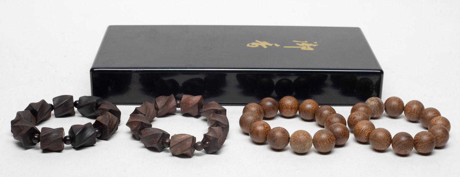 Set Asian Wood Prayer Beads Collection: Set of four strings of Asian wood carved prayer beads, with box. Approx. 192 gram (total bead weight).