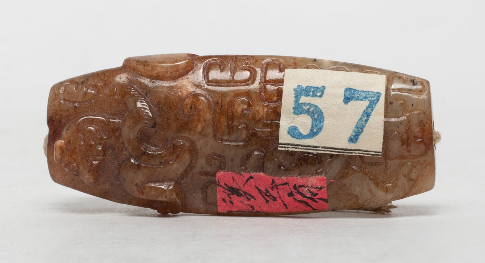 Chinese Russet Jade Dragon Long Bead: Long Chinese russet jade bead carved in relief with stylized dragons and figure. Approx. 2.57*1.05*0.6 inch.