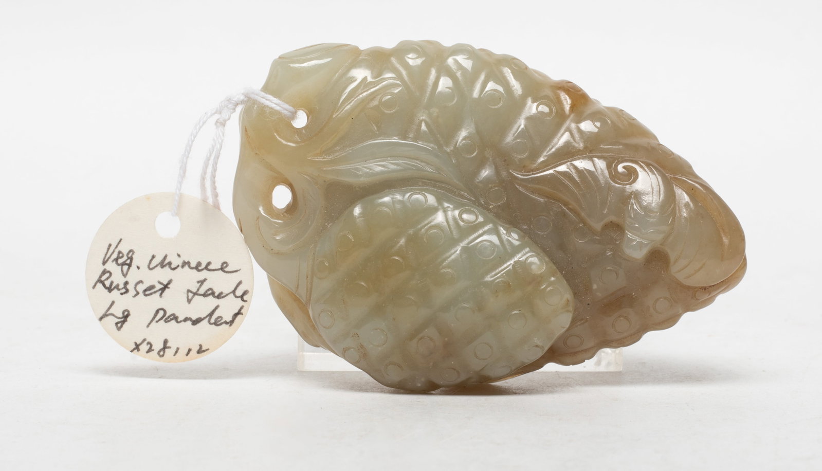 Large Chinese Russet Jade Pendant: Large Chinese russet jade pendant carved with litchi and bat. Approx. 3.15*2.1*0.9 inch.