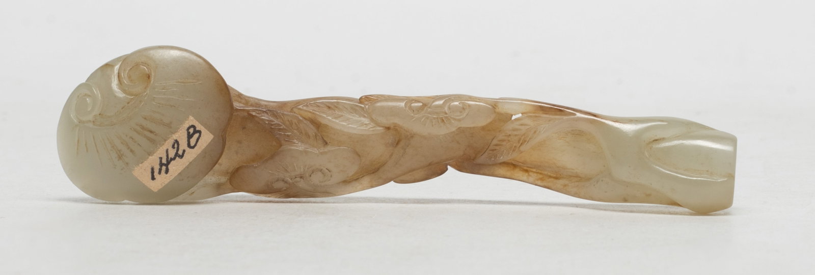 Estate Chinese Jade Carved Pendant of Ruyi: Chinese russet jade pendant of ruyi, the shaft carved with leafy lingzhi branches. Approx. 4.2*1*0.6 inch.
