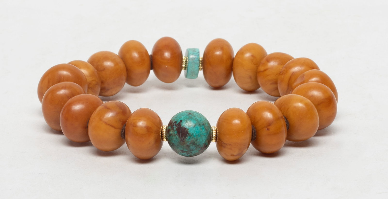 Estate Chinese Amber Prayer Beads: A string of Chinese amber and stone carved prayer beads. Size varies.